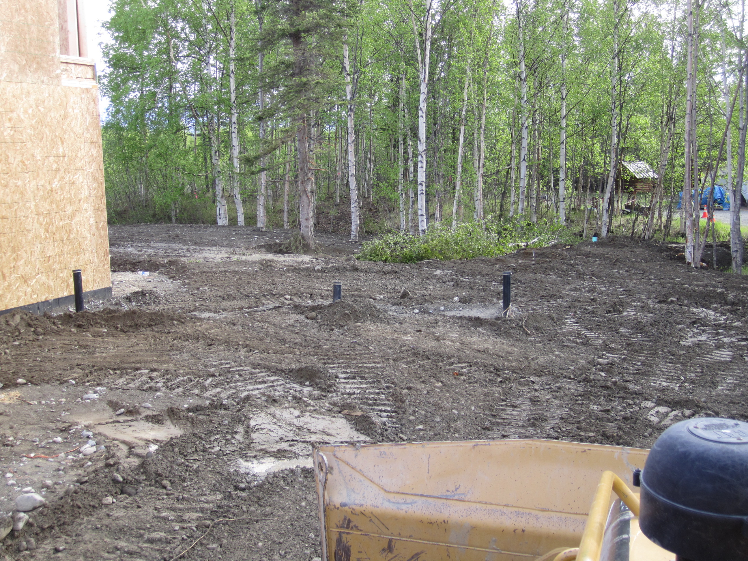 Excavator, dozer and loader, hailing dirt in wasilla alaska. 